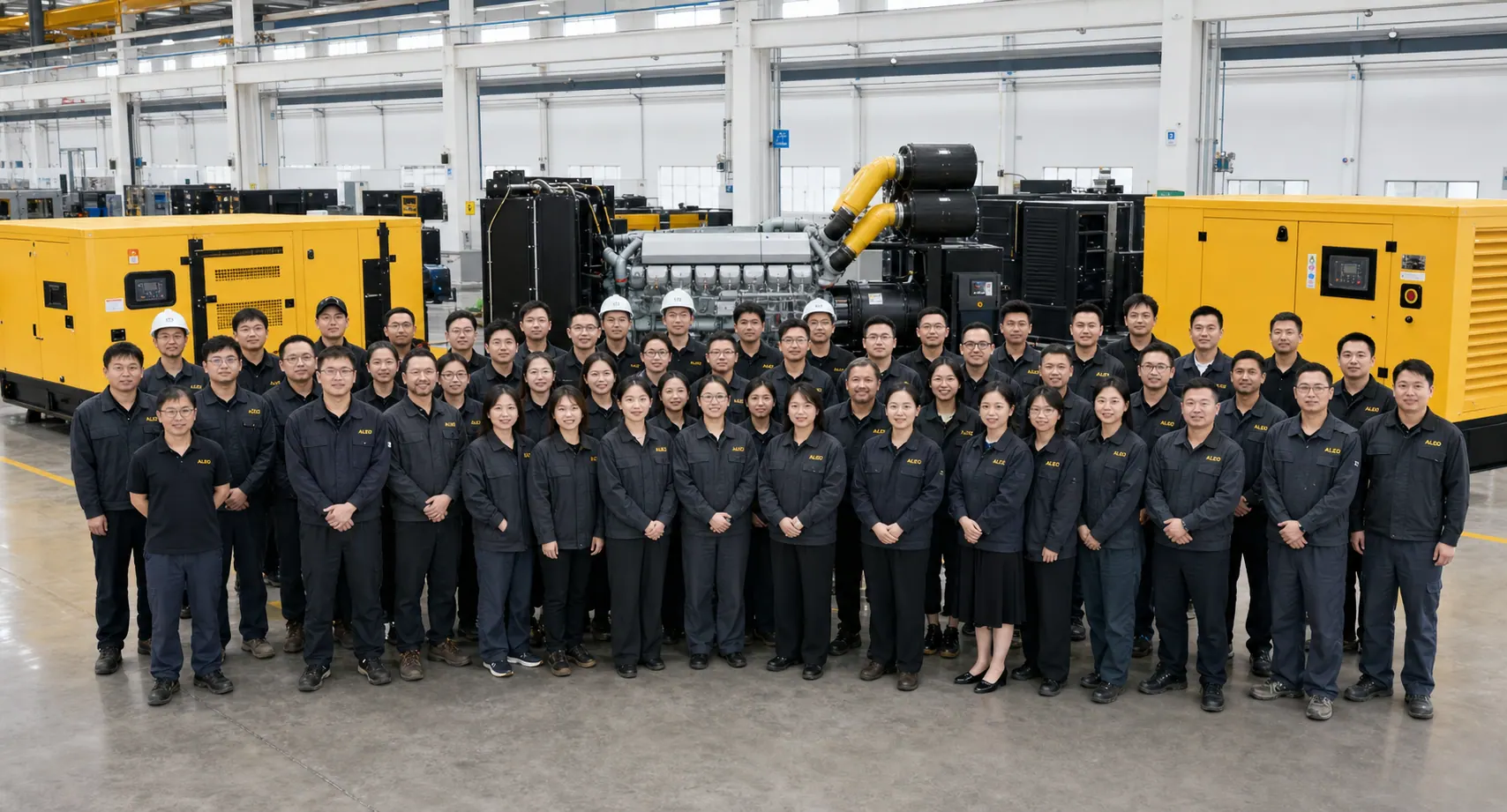 ALEO POWER factory team standing with industrial generator sets